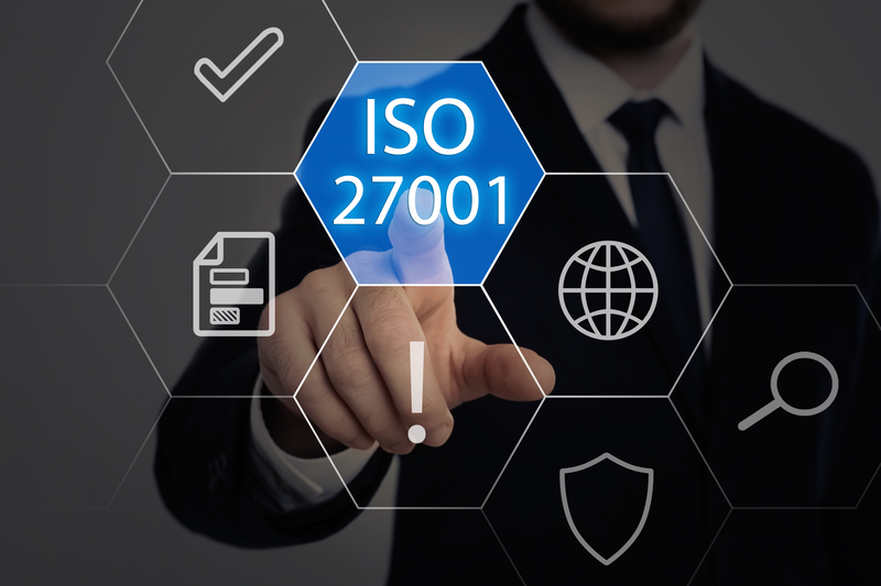 Iso 27001 image with a man in a suit pressing a button